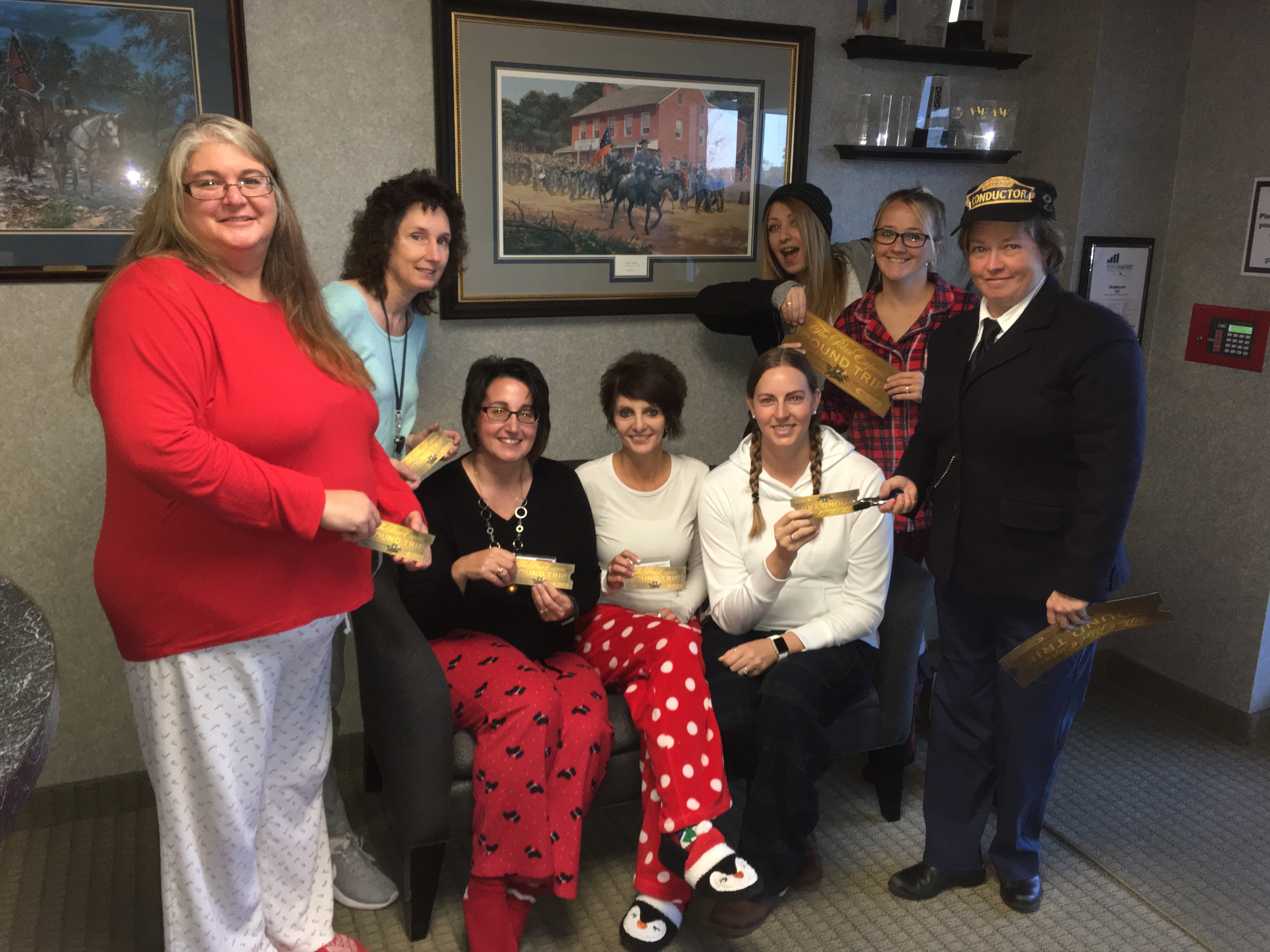 graphcom employees dressed as The Polar Express for spirit week