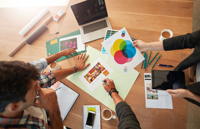 marketing agency workers reviewing projects together