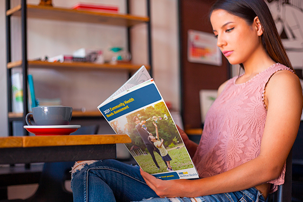 woman reading health needs assessment