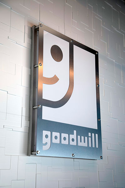 goodwill logo wall sign