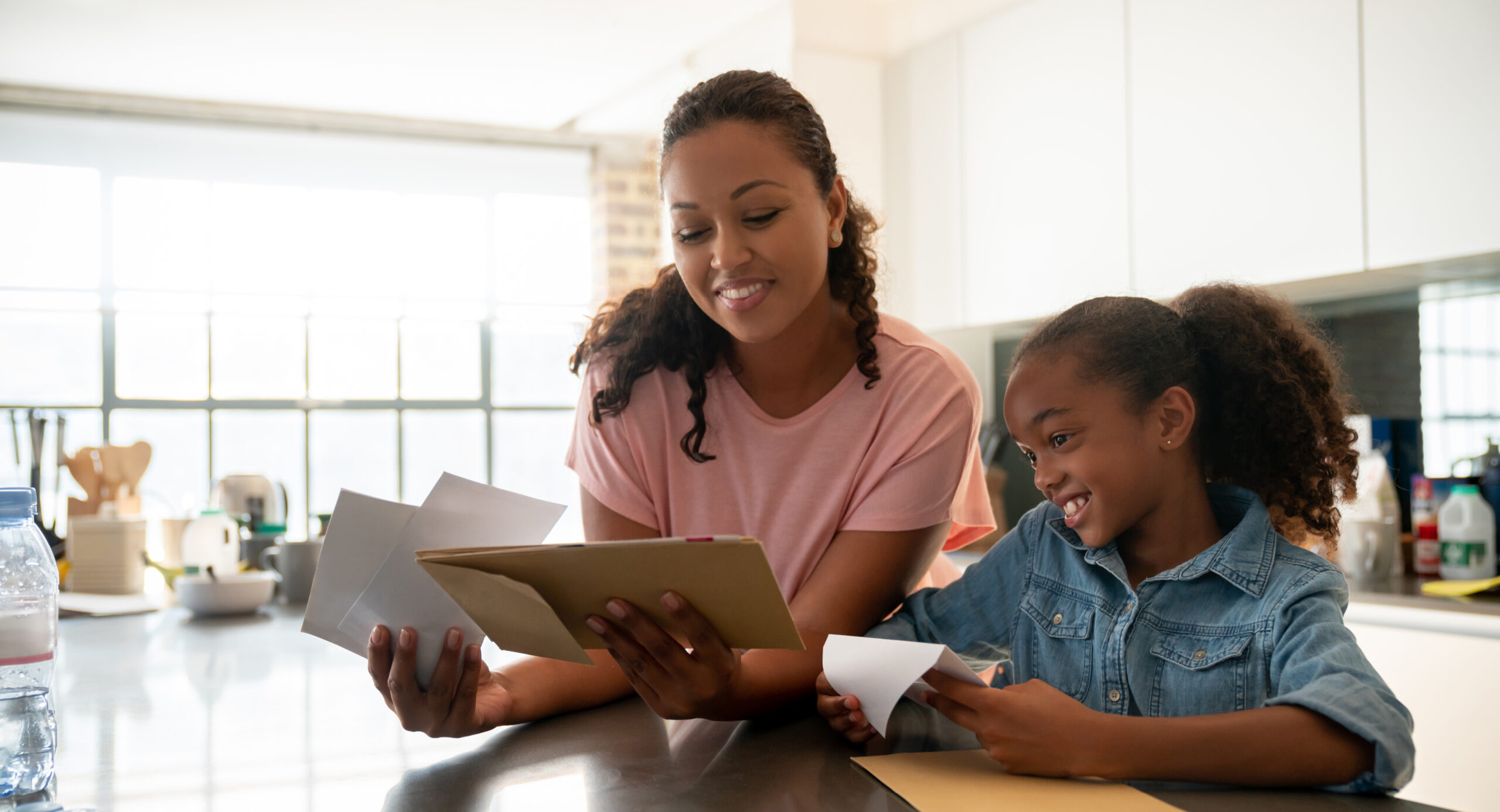 mother and daughter reading the news together