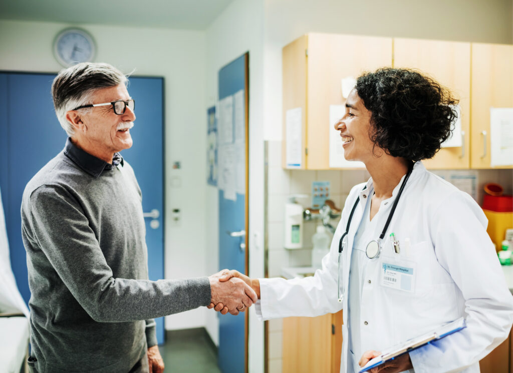 elderly male patient meeting female doctor